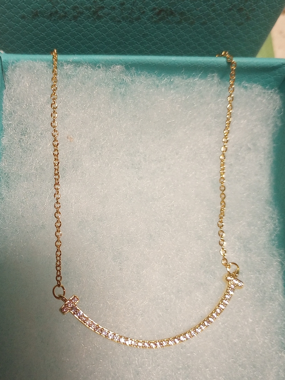 Tiffany & Co. Gold Curved Bar Necklace with Clear Stones